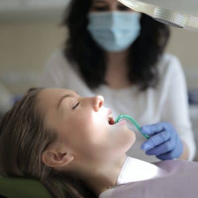 Dental cleaning provided by oral health professional at patient's home